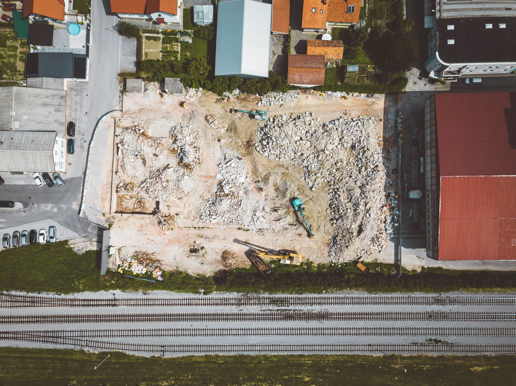 Top-down view of a construction site with a bulldozer at work.